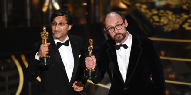 HOLLYWOOD, CA - FEBRUARY 28: Filmmakers Asif Kapadia (L) and James Gay-Rees accept the Best Documentary Feature award for 'Amy' onstage during the 88th Annual Academy Awards at the Dolby Theatre on February 28, 2016 in Hollywood, California. (Photo by Kevin Winter/Getty Images)