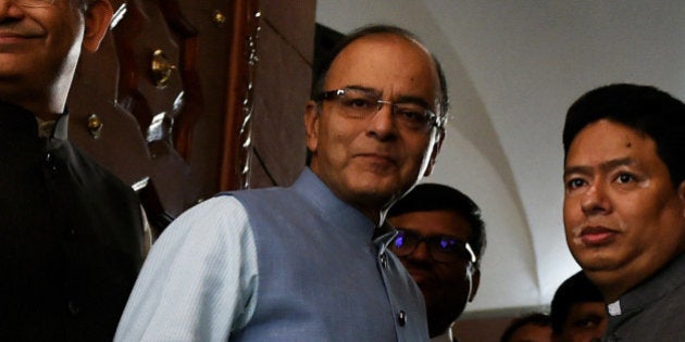 Indian Finance Minister Arun Jaitley (C) arrives at Parliament House in New Delhi on February 29, 2016, ahead of release of the General Budget. India's government is likely to lay out growth-boosting measures and overhaul its tax regime in its budget, after warning that a weak global climate was hurting Asia's third-largest economy. AFP PHOTO / Money SHARMA / AFP / MONEY SHARMA (Photo credit should read MONEY SHARMA/AFP/Getty Images)