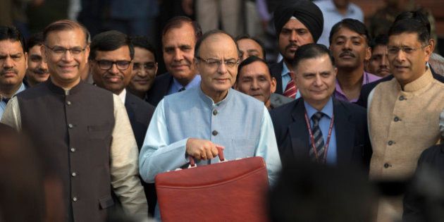 Indian Finance Minister Arun Jaitley, center, leaves for annual budget presentation at parliament in New Delhi, India, Monday, Feb. 29, 2016. It was Jaitleyâs second full budget since Prime Minister Narendra Modi won a huge majority in national election in 2014, on the back of promises to turn around the economy and boost job creation. There have been few sweeping reforms in the past two years that the government has been promising. (AP Photo /Tsering Topgyal)
