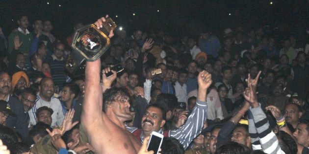 DEHRADUN, INDIA - FEBRUARY 28: Dalip Singh Rana, a former WWE (World Wrestling Entertainment) wrestler better known by his ring name The Great Khali showing his belt after he won a wrestling match at WWE wrestling event on February 28, 2016 in Dehradun, India. International wrestler Dalip Singh Rana, popularly known as The Great Khali, who was admitted in a Dehradun hospital four days back after sustaining serious injuries, bounced back on Sunday night to win the high-voltage wrestling match in which he trounced three foreign wrestlers Brody Steel, Mike Knox and Apollo Leon. (Photo by Vinay Santosh Kumar/Hindustan Times via Getty Images)