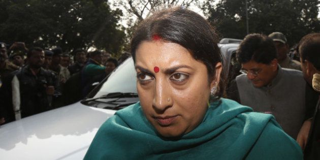 NEW DELHI, INDIA - DECEMBER 21: HRD Minister Smriti Irani comes out of the Patiala Court on December 21, 2015 in New Delhi, India. Finance Minister Arun Jaitley filed a defamation suit against Delhi Chief Minister Arvind Kejriwal and sought Rs.10 crore in damages for accusing him of corruption when he headed the DDCA. Kejriwal retorted that he and his AAP can't be intimidated. (Photo by Ravi Choudhary/Hindustan Times via Getty Images)