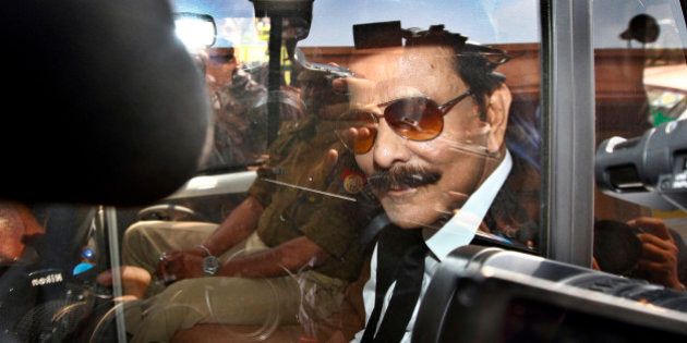 NEW DELHI, INDIA - MARCH 4: Sahara Chairman Subrata Roy arrives at the Supreme Court on March 4, 2014 in New Delhi, India. An attacker, Manoj Sharma, claiming to be a lawyer from Gwalior, Madhya Pradesh managed to get close to Roy in the crowd and threw black ink on him. He was later detained and led away. Subrata Roy, head of the Sahara India conglomerate was accused by Indiaâs regulatory body SEBI of raising nearly 200 billion rupees ($3.2 billion) through bonds that were later found to be illegal. (Photo by Arun Sharma/Hindustan Times via Getty Images)