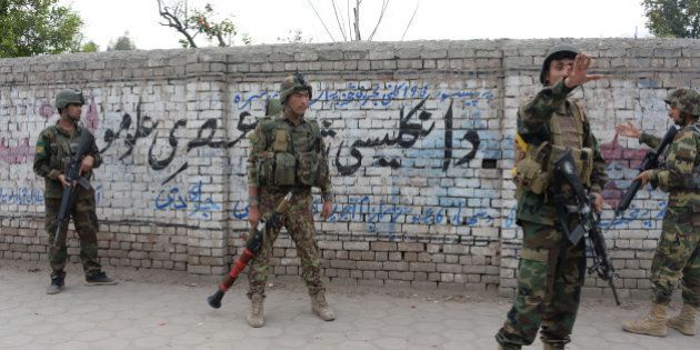 Afghan National Army (ANA) soldiers arrive at the site of an attack in front of the Indian consulate in Jalalabad on March 2, 2016. Explosions and gunfire echoed on March 2 as militants attacked the Indian consulate in Jalalabad in the latest assault to rattle the eastern Afghan city. AFP PHOTO / Noorullah SHIRZADA / AFP / Noorullah Shirzada (Photo credit should read NOORULLAH SHIRZADA/AFP/Getty Images)
