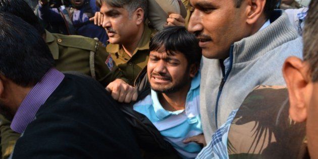 Indian student union leader Kanhaiya Kumar (C) is escorted by police into Patiala Court for a hearing in New Delhi on February 17, 2016. Student union leader Kanhaiya Kumar had been arrested for allegedly shouting anti-India slogans at a rally called to protest against a Kashmiri separatist's execution three years ago -- a charge he denies. His arrest has reignited a row over freedom of expression in India, where some rights campaigners say the Hindu nationalist government is using the British-era sedition law to clamp down on dissent. AFP PHOTO / CHANDAN KHANNA / AFP / Chandan Khanna (Photo credit should read CHANDAN KHANNA/AFP/Getty Images)