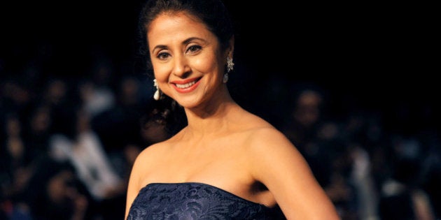 Indian Bollywood film actress Urmila Matondkar attends the Lakme Fashion Week (LFW) Winter/Festival 2013 in Mumbai on August 23, 2013. AFP PHOTO (Photo credit should read STR/AFP/Getty Images)