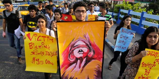 Students participate in a walk protesting violence against women in Kolkata, India, Thursday, April 2, 2015. The protestors demanded immediate trial and verdict on rape cases, according to a press handout. Posters read