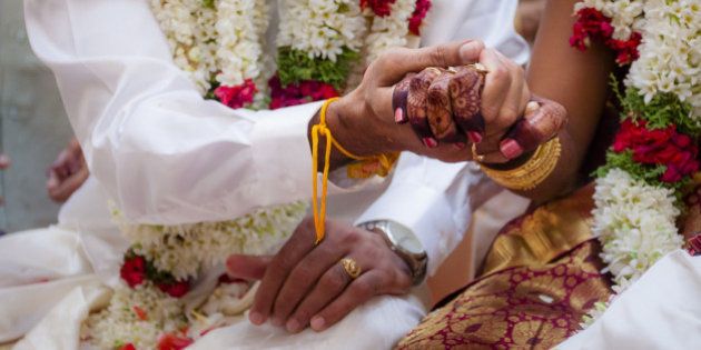 This moment is captured during the rituals process in a Indian Hindu wedding.