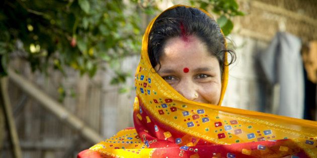 Woman wearing traditional Indian Sari for clothing. Dibrugarh, Arunachel Pradesh, North East India.