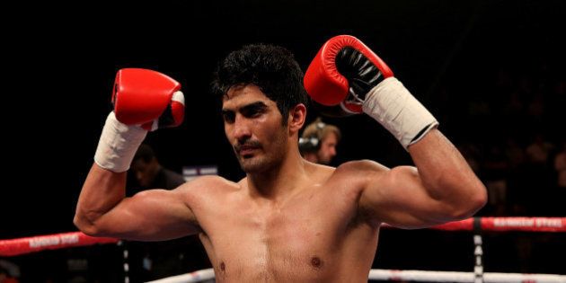 MANCHESTER, ENGLAND - OCTOBER 10: Vijender Singh of India celebrates after defeating Sonny Whiting of Great Britain exchange blows during their International Middleweight contest at Manchester Arena on October 10, 2015 in Manchester, England. (Photo by Ben Hoskins/Getty Images)