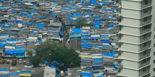 The Mumbai skyline where shanties occupy the same real estate next to swanky high rises in downtown Mumbai, India, Wednesday, July 15, 2015. (AP Photo/Rafiq Maqbool)
