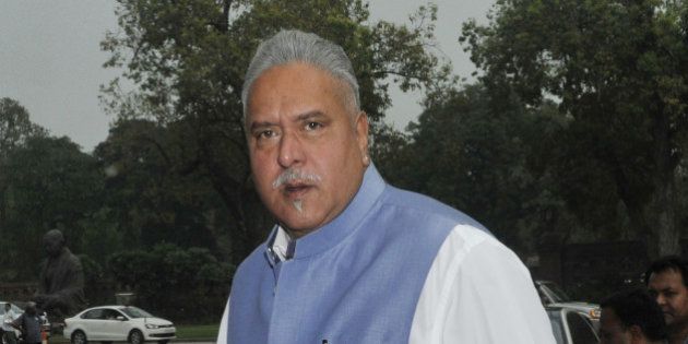 NEW DELHI, INDIA - FEBRUARY 23: Businessman and Rajya Sabha MP Vijay Mallya coming out after the Presidential address of both houses on the first day of Budget Session at Parliament House on February 23, 2015 in New Delhi, India. The budget session of the parliament began today and the Union Budget will be presented on February 28. (Photo by Vipin Kumar/Hindustan Times via Getty Images)