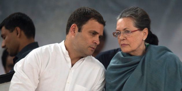 Congress party President Sonia Gandhi, right, listens to her son and party Vice President Rahul Gandhi during celebrations marking the birth anniversary of the first Indian Prime Minister Jawaharlal Nehru in New Delhi, India, Saturday, Nov. 14, 2015. The day is also marked as Children's Day in India. (AP Photo /Tsering Topgyal)