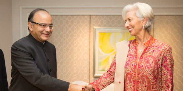 NEW DELHI, INDIA - MARCH 11: In this handout photo provided by the International Monetary Fund, International Monetary Fund Managing Director Christine Lagarde (R) and IndiaÃ¢s Finance Minister Arun Jaitley (L) shake hands after they signed a memo of understanding March 11, 2016 at the Taj Palace Hotel in New Delhi, India. (Photo by Stephen Jaffe/IMF via Getty Images)