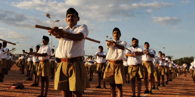 Members of Rashtriya Swayamsevak Sangh (RSS) - National Volunteers Organisation - take part in a physical drill during a public meeting in Bangalore on November 22, 2009. RSS Chief Mohan Rao Bhagwat arrived in the city to review the functioning of various state wings of the RSS and hold meetings with representatives of various social organisations. Bhagwat addressed the public meeting attended by thousands of RSS volunteer and followers. AFP PHOTO/Dibyangshu SARKAR (Photo credit should read DIBYANGSHU SARKAR/AFP/Getty Images)