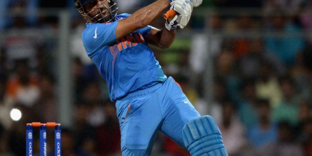 MUMBAI, INDIA - MARCH 12: Mahendra Singh Dhoni of India bats during the ICC Twenty20 World Cup warm up match between India and South Africa at Wankhede Stadium on March 12, 2016 in Mumbai, India. (Photo by Gareth Copley/Getty Images,)
