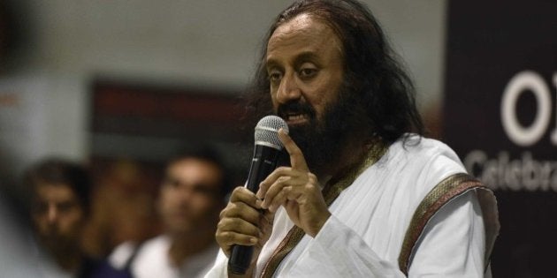 NEW DELHI, INDIA - MARCH 13: Spiritual Guru Sri Sri Ravi Shankar addressing a press conference during the World Culture Festival organised by the Art of Living Foundation headed by Sri Sri Ravi Shankar, on March 13, 2016 in New Delhi, India. The mega event witness artists, musicians and dancers from across the globe participating with utmost zest and enthusiasm. The 3-day mega event was embroiled in controversy till the very last moment before the National Green Tribunal gave it a green signal. But not before the organisers submitted Rs 25 lakh, part of the Rs 5 crore fine imposed by the green tribunal. (Photo by Virendra Singh Gosain/Hindustan Times via Getty Images)