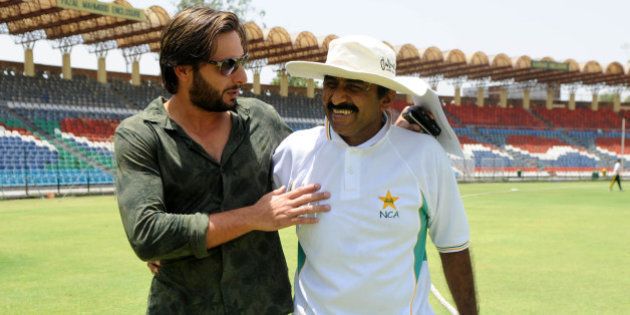 Pakistani cricket captain Shahid Afridi shares a light moment with Pakistani Cricket Board (PCB) director Javed Miandad at The Gaddafi Stadium in Lahore on May 25, 2010. Dashing all-rounder Shahid Afridi was named Pakistan skipper for next month's Asia Cup and the following tour of England, uniting the team under one captain for all three formats of the game. AFP PHOTO/Arif ALI (Photo credit should read Arif Ali/AFP/Getty Images)