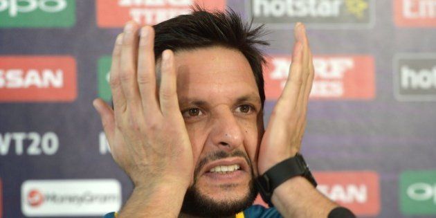 Pakistan's captain Shahid Afridi gestures as he addresses media representatives at a press conference at The Eden Gardens Cricket Stadium in Kolkata on March 13, 2016, ahead of the World T20 cricket tournament. / AFP / Dibyangshu SARKAR (Photo credit should read DIBYANGSHU SARKAR/AFP/Getty Images)