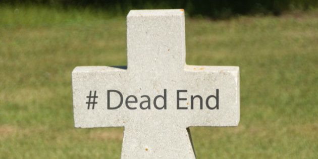 Hashtag Dead End written on an older marble tombstone with copy space.