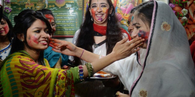 LAHORE, PUNJAB, PAKISTAN - 2015/03/05: Devotees were enjoying wiping colored powders in each other as they celebrate the Holi festival. Pakistani Hindu community gather in Krishna Temple to take a part of their religious rituals to celebrate Holi, the Spring Festival of Colors. (Photo by Rana Sajid Hussain/Pacific Press/LightRocket via Getty Images)