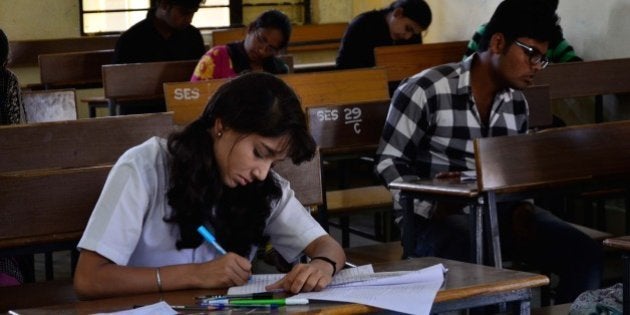 BHOPAL, INDIA - MARCH 1: Students appear for the CBSE class 12th examinations at Govt. Subhash School of Excellence on March 1, 2016 in Bhopal, India. CBSE class X and XII board exams have begun from today and will end on March 28 and April 22, respectively. This year, over 25 lakh students has registered for the Central Board of Secondary Education (CBSE) exams, around 6.3 per cent more than last year's total. Nearly 15 lakh students are expected to appear for 10th and over 10.5 lakh for the 12th exams. The exams for class 10th will continue till March 28th and class 12th exams will end on April 22nd. (Photo by Mujeeb Faruqui/Hindustan Times via Getty Images)