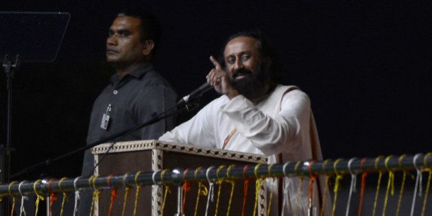 Spiritual leader Sri Sri Ravi Shankar speaks on the first day of the three-day World Culture Festival in New Delhi on March 11, 2016. Some 500,000 people are expected to attend the festival, the organisers told the court, although earlier advertisements suggested it would draw more than three million visitors with India's Prime Minister Narendra Modi also expected to attend the event on the banks of the Yamuna River in the Indian capital. / AFP / MONEY SHARMA (Photo credit should read MONEY SHARMA/AFP/Getty Images)