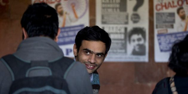 Umar Khalid, a student leader of Jawaharlal Nehru University (JNU) appears at the campus, along with four others, not in photo, who face charges of sedition, in New Delhi, India, Monday, Feb. 22, 2016. Khalid and four other students went underground after a program earlier in the month at the university in the favor to mark the anniversary of the 2013 execution of Afzal Guru, a Kashmiri man convicted of an attack on India's Parliament. (AP Photo/Manish Swarup)