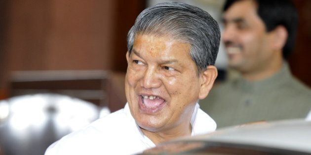 NEW DELHI, INDIA - SEPTEMBER 5: Congress leader and Union Minister of Water Resources Harish Rawat leaves after attending the ongoing Parliament Monsoon Session on September 5, 2013 in New Delhi, India. The Monsoon Session of Parliament has been extended by a day till Saturday to ensure passage of certain key measures including the Land Acquisition Bill. (Photo By Sonu Mehta/Hindustan Times via Getty Images)