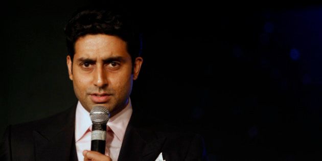 Bollywood actor Abhishek Bachchan talks during the awarding ceremony for the Green Globe Award trophy for outstanding contribution by a celebrity during the Delhi Sustainable Development Summit in New Delhi, India, Thursday, Feb. 2, 2012. (AP Photo/Tsering Topgyal)