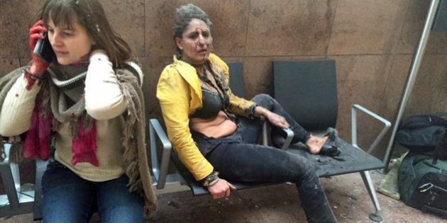 ADDS NAME AND DETAILS OF THE WOMAN AT RIGHT: In this photo provided by Georgian Public Broadcaster and photographed by Ketevan Kardava, Nidhi Chaphekar, a 40-year-old Jet Airways flight attendant from Mumbai, right, and another unidentified woman after being wounded in Brussels Airport in Brussels, Belgium, after explosions were heard Tuesday, March 22, 2016. A developing situation left at least one person and possibly more dead in explosions that ripped through the departure hall at Brussels airport Tuesday, police said. All flights were canceled, arriving planes were being diverted and Belgium's terror alert level was raised to maximum, officials said. (Ketevan Kardava/ Georgian Public Broadcaster via AP)