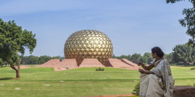 Auroville (City of Dawn) is an experimental township in Viluppuram district in the state of Tamil Nadu, India, near Puducherry in South India. The Matrimandir, a golden metallic sphere in the center of town.