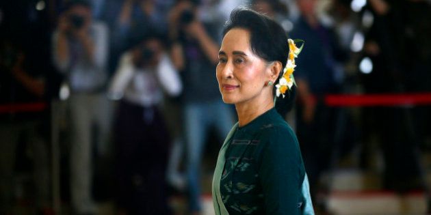 National League for Democracy party (NLD) leader Aung San Suu Kyi arrives in Manama's parliament in Naypyitaw, Myanmar, Tuesday, March 15, 2016. Myanmar's parliament votes Tuesday to pick the country's next president from a group of three final candidates, including a front runner who is a longtime confidant of Nobel laureate Suu Kyi. (AP Photo/Gemunu Amarasinghe)