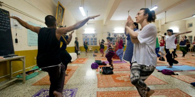 MUMBAI, INDIA JUNE 16: Yoga Studio offering regular yoga classes for the benefit of their members at Santacruz on June 16, 2015 in Mumbai, India. (Photo by Pradeep Gaur/Mint via Getty Images)