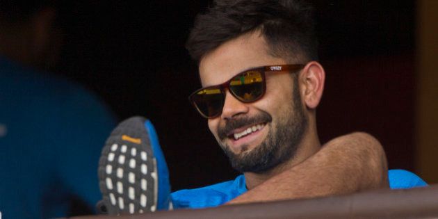 India's Virat Kohli smiles as he rests after a practice session ahead of their match against New Zealand in the ICC World Twenty20 2016 cricket tournament in Nagpur, India, Monday, March 14, 2016. (AP Photo/Saurabh Das)