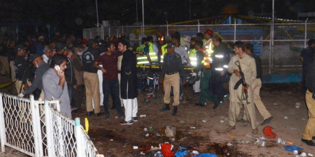 LAHORE, PUNJAB, PAKISTAN - 2016/03/27: (EDITORS NOTE: Image contains graphic content.) Pakistani rescuers and officials gather at a bomb blast site in Lahore. At least 52 people were killed and dozens injured when an explosion ripped through the parking lot of a crowded park where many minority Christians had gone to celebrate Easter Sunday, officials said. (Photo by Rana Sajid Hussain/Pacific Press/LightRocket via Getty Images)