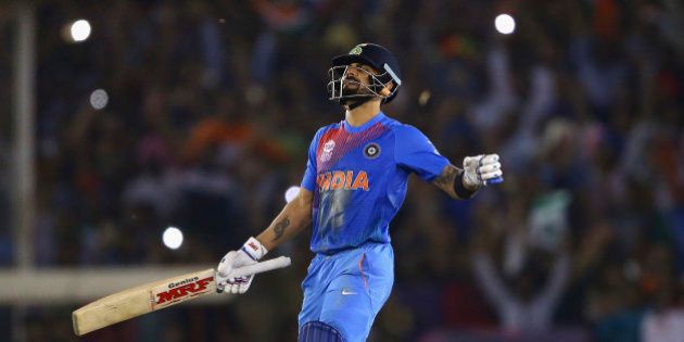 MOHALI, INDIA - MARCH 27: Virat Kohli of India celebrates victory during the ICC WT20 India Group 2 match between India and Australia at I.S. Bindra Stadium on March 27, 2016 in Mohali, India. (Photo by Ryan Pierse/Getty Images)