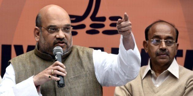NEW DELHI, INDIA - FEBRUARY 15: BJP President Amit Shah addresses the media on Jawaharlal Nehru University row at BJP Headquarters on February 15, 2016 in New Delhi, India. Slamming Congress Vice President Rahul Gandhi for lending support to Jawaharlal Nehru University students who eulogised the 2001 Parliament attack convict Afzal Guru, BJP President Amit Shah on Monday sought an apology from Gandhi for supporting 'anti-nationals and separatists'. He demanded an immediate apology from Congress President Sonia Gandhi and Rahul Gandhi for supporting anti-India protests at JNU. JNU has been on the boil over the arrest of its studentsâ Union President Kanhaiya Kumar on sedition charges after some students organised a meet to mark the anniversaries of executions of Parliament attack convict Afzal Guru. (Photo by Mohd Zakir/Hindustan Times via Getty Images)