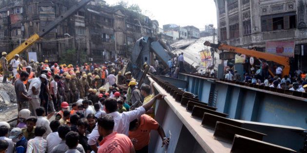 KOLKATA, WEST BENGAL, INDIA - 2016/03/31: At least 22 people have been killed and several injured after an under construction flyover collapsed in near Ganesh Talkies ( Girish Park), North Kolkata. Several people are still trapped under the debris. West Bengal Chief Minister Mamata Banerjee cancelled her political rally for upcoming state legislative election and superintendence the rescue operation. (Photo by Saikat Paul/Pacific Press/LightRocket via Getty Images)