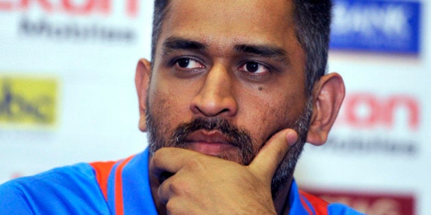 Indian cricket team captain Mahendra Sing Dhoni listens to a question during a unveiling ceremony of Celkon Tri-Nation series cup in Kingston on June 27, 2013. Sri Lanka will face West Indies in the first match of a Tri Nation series involving India too. AFP PHOTO/Jewel Samad (Photo credit should read JEWEL SAMAD/AFP/Getty Images)