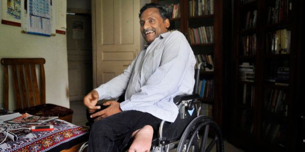NEW DELHI, INDIA - JULY 6: Professor GN Saibaba during an interview at his residence in the Delhi University North Campus on July 6, 2015 in New Delhi, India. A lecturer in the English Department, he was arrested by Maharashtra Police last year for alleged Maoist links and jailed in the Nagpur Central Prison. He was granted bail for three months by the Mumbai High Court so that he could consult doctors for several ailments. (Photo by Sushil Kumar/Hindustan Times via Getty Images)