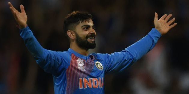 India's Virat Kohli celebrates after taking the wicket of West Indies's Johnson Charles during the World T20 men's semi-final match between India and West Indies at The Wankhede Cricket Stadium in Mumbai on March 31, 2016. / AFP / INDRANIL MUKHERJEE (Photo credit should read INDRANIL MUKHERJEE/AFP/Getty Images)
