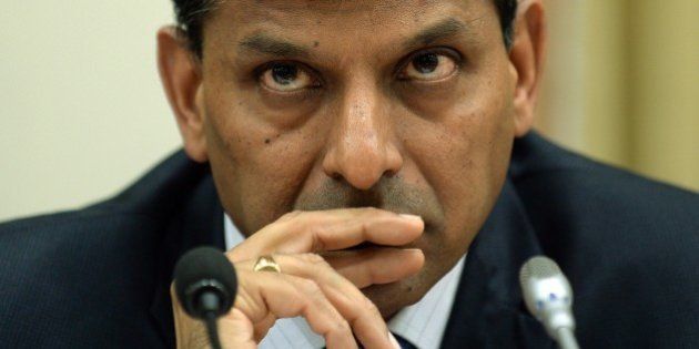 Reserve Bank of India (RBI) governor Raghuram Rajan listens to a question during a news conference at the RBI headquarters in Mumbai on December 2, 2014. India's central bank kept interest rates unchanged on December 2 despite growing calls to ease monetary policy, saying a reduction would be 'premature'. AFP PHOTO/ PUNIT PARANJPE (Photo credit should read PUNIT PARANJPE/AFP/Getty Images)