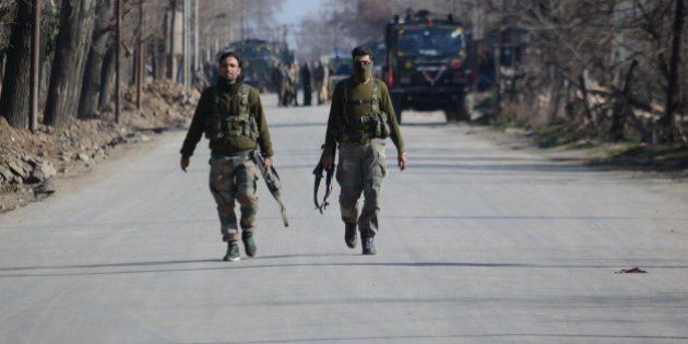 PAMPORE, KASHMIR-INDIA FEBRUARY 22: Special operation group cops patrol nearthe encounter site in Pampore some 15 kilometers from Srinagar the summer capital of Indian controlled Kashmir on February 22, 2016.N ine persons including two Indian army captains, three CRPF soldiers, three militants and a civilian were killed when suspected militants attacked a military convoy on Srinagar National highway near Pampore, the militants then took refuge in a nearby government building where a fierce gunbattle between government forces and militants took place, Indian army said. (Photo by Faisal Khan/Anadolu Agency/Getty Images)