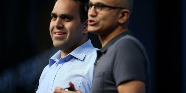 SAN FRANCISCO, CA - MARCH 30: Visually impaired Microsoft developer Saqib Shaikh (L) stands next to Microsoft CEO Satya Nadella as he delivers the keynote address during the 2016 Microsoft Build Developer Conference on March 30, 2016 in San Francisco, California. The Microsoft Build Developer Conference runs through April 1. (Photo by Justin Sullivan/Getty Images)
