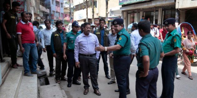 Bangladeshi police officers investigate at the spot where three motorcycle-riding assailants hacked student activist Nazimuddin Samad to death while walking with a friend, in Dhaka, Bangladesh, Thursday, April 7, 2016. Police suspect 28-year-old Samad was targeted for his outspoken atheism in the Muslim majority country and for supporting a 2013 movement demanding capital punishment for war crimes involving the country's independence war against Pakistan in 1971, according to Dhaka Metropolitan Police Assistant Commissioner Nurul Amin. ( AP Photo)