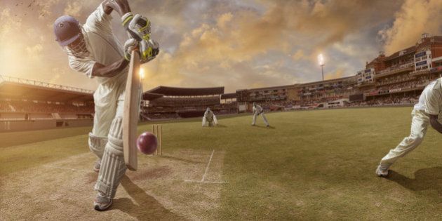Batsman just after hitting ball in professional cricket match in full stadium at sunset during summer.Stadium is fake created in photoshop.