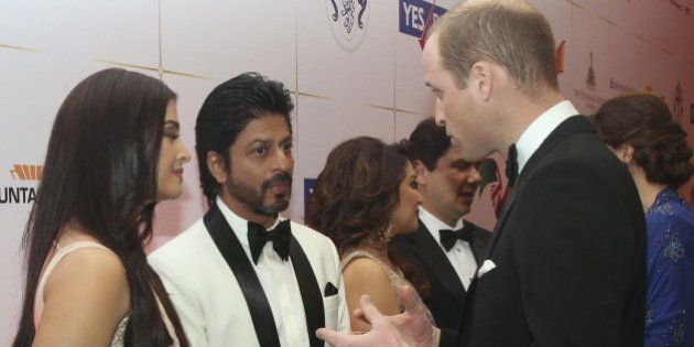 Britain's Prince William speaks to Bollywood actors Shah Rukh Khan and Aishwarya Rai at reception at Taj hotel in Mumbai, India, Sunday, April 10, 2016. REUTERS/Rafiq Maqbool/Pool