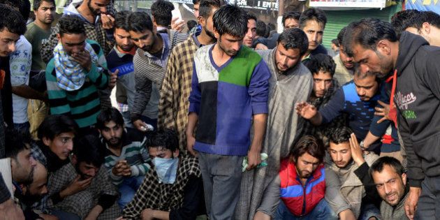 Kashmiri villagers surround the bodies of two civillians reported to have been killed in clashes with security personnel in Handwara, some 70kms north-west of Srinagar on April 12, 2016.Soldiers shot dead two civilians April 12 in Indian-administered Kashmir when they fired at a protesting crowd angry over alleged molestation of a local girl by their colleague, police said. The incident occurred In Handwara town, 70 kilometers north-west of the main city of Srinagar, near the heavily militarized Line of Control that divides Kashmir between India and Pakistan.The protesters attacked an army bunker and in retaliation soldiers fired in which the two died,' inspector general of police for the region, Javid Gillani told AFP. / AFP / STR (Photo credit should read STR/AFP/Getty Images)
