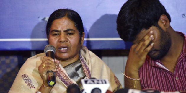 NEW DELHI, INDIA - FEBRUARY 26: Mother Radhika of Dalit research scholar Rohith Vemula with Prasanth Dontha, a student expelled from Hyderabad University, at a press conference on HRD Minister Smriti Iraniâs speech in Parliament on Rohith Vemula suicide on February 26, 2016 in New Delhi, India. Rohith Vemulaâs family and friends today attacked Union Education Minister Smriti Irani, calling her speech in Parliament on the research scholar's suicide a set of absolute lies. (Photo by Virendra Singh Gosain/Hindustan Times via Getty Images)