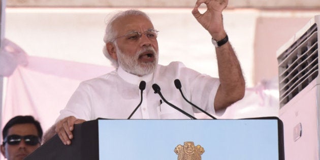 NEW DELHI, INDIA - MARCH 19: Prime Minister Narendra Modi speaks during the three-day Krishi Unnati Mela providing information on new farm schemes and technologies that will help farmers double their incomes within the next few years, on March 19, 2016 in New Delhi, India. Modi described the Krishi Unnati Mela as a platform that could rewrite India's destiny. (Photo by Virendra Singh Gosain/Hindustan Times via Getty Images)